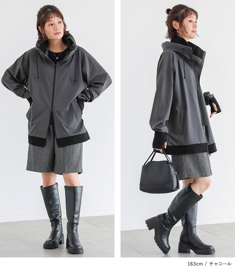 チャコールのパーカーにチェック柄ショートパンツと黒のロングブーツを合わせたトレンド感あふれる秋コーデ。高めのスタンドネックで防寒とおしゃれを両立します。