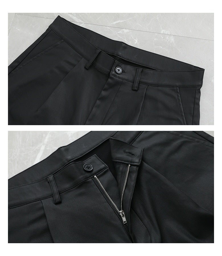 フェイクレザーバレルパンツのフロントウエストとジップファスナー仕様。タック入りの腰周りと開閉しやすい前ジッパー、ベルトループ付きの本格的な仕立てで、タックインスタイルも綺麗に決まります。